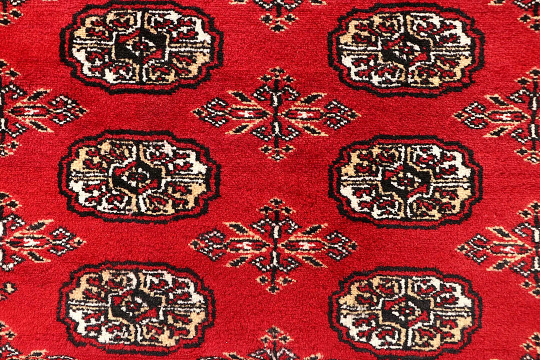 Crimson Pakistani Bokhara Rug 6' 5" x 8' 11" Hand-Knotted | No. QA39092