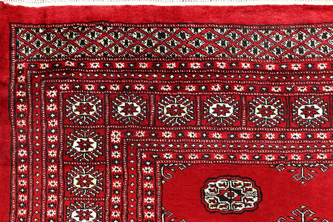 Red Pakistani Bokhara Rug 6' 1" x 9' 2" Hand-Knotted | No. QA39175