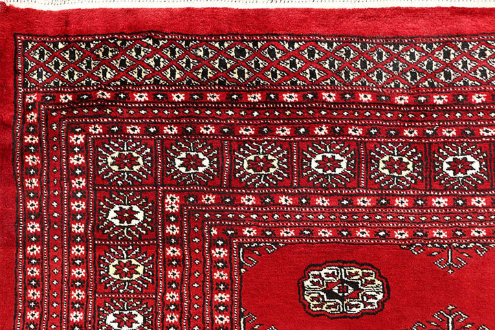 Red Pakistani Bokhara Rug 6' 1" x 9' 2" Hand-Knotted | No. QA39175