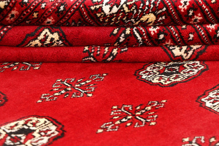 Red Pakistani Bokhara Rug 6' 1" x 9' 2" Hand-Knotted | No. QA39175