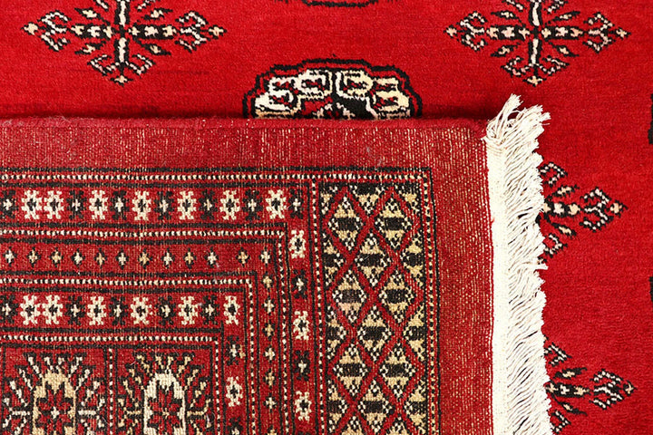 Red Pakistani Bokhara Rug 6' 1" x 9' 2" Hand-Knotted | No. QA39175