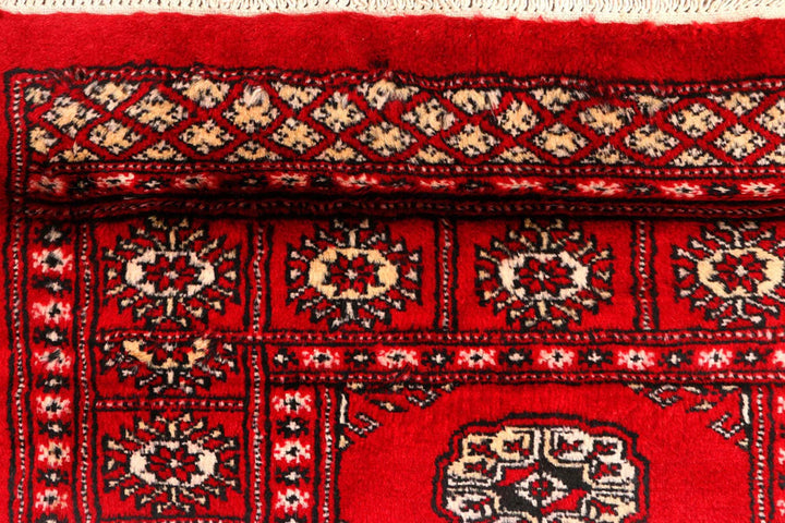 Dark Red Pakistani Bokhara Rug 2' 6" x 10' 6" Hand-Knotted | No. QA39419
