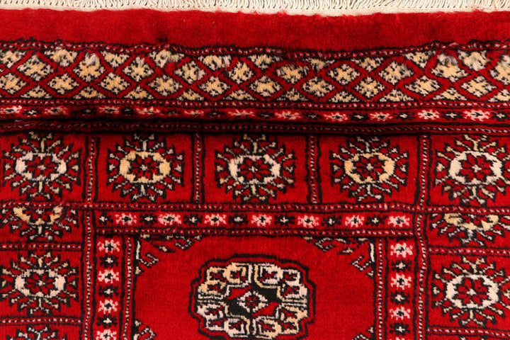 Dark Red Pakistani Bokhara Rug 2' 6" x 10' 6" Hand-Knotted | No. QA39419