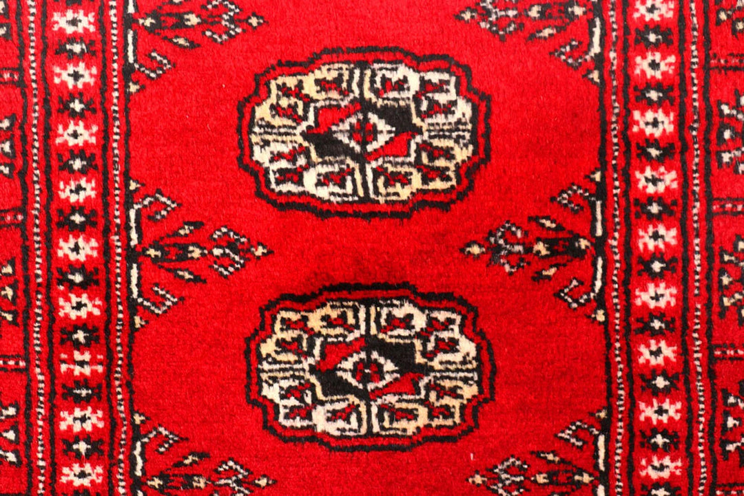 Dark Red Pakistani Bokhara Rug 2' 6" x 10' 6" Hand-Knotted | No. QA39419
