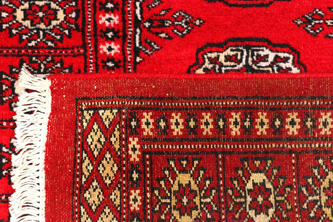 Dark Red Pakistani Bokhara Rug 2' 6" x 10' 6" Hand-Knotted | No. QA39419