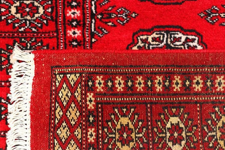 Dark Red Pakistani Bokhara Rug 2' 6" x 10' 6" Hand-Knotted | No. QA39419