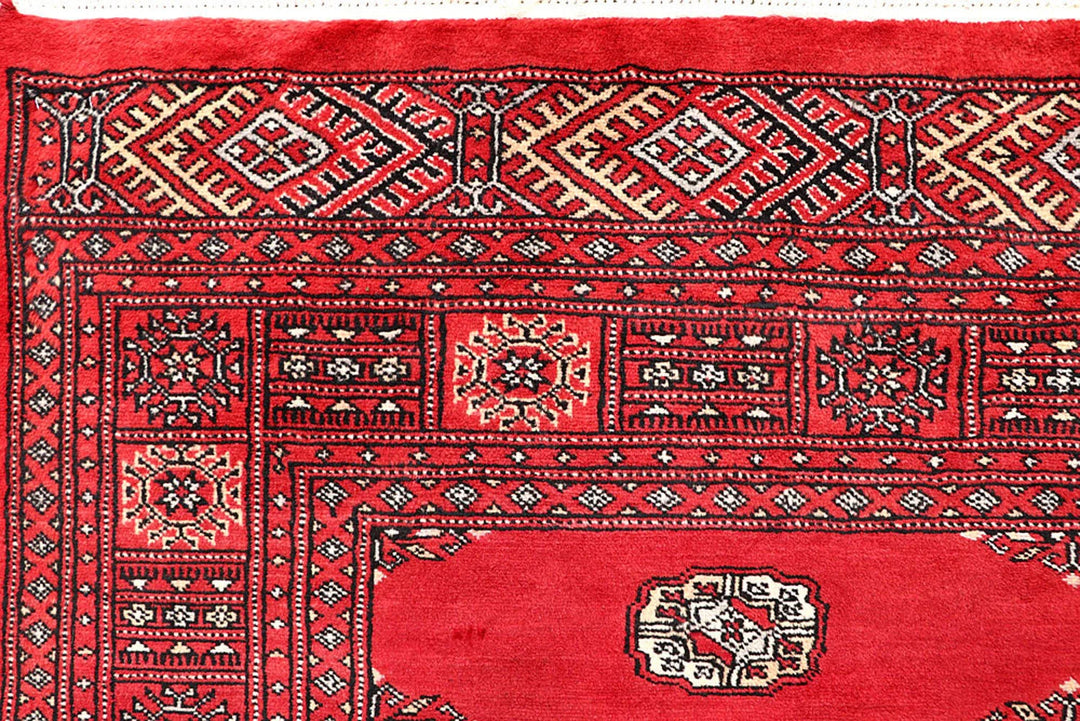 Red Pakistani Bokhara Rug 5' 1" x 7' 10" Hand-Knotted | No. QA39988