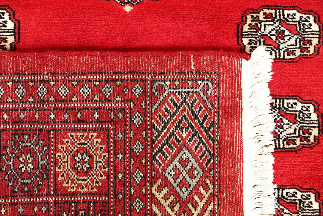 Red Pakistani Bokhara Rug 5' 1" x 7' 10" Hand-Knotted | No. QA39988