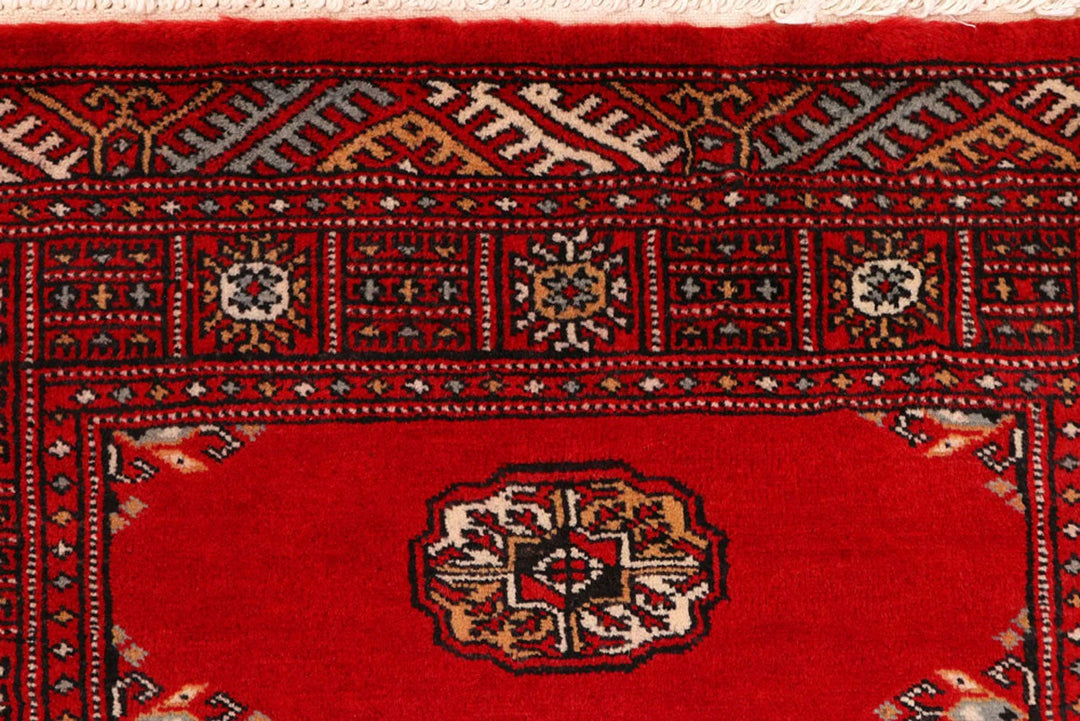 Red Pakistani Bokhara Rug 2' 7" x 9' 1" Hand-Knotted | No. QA40235