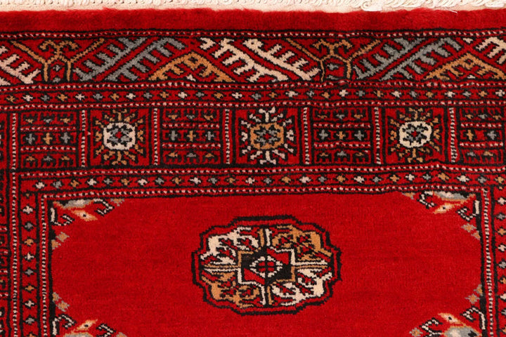Red Pakistani Bokhara Rug 2' 7" x 9' 1" Hand-Knotted | No. QA40235