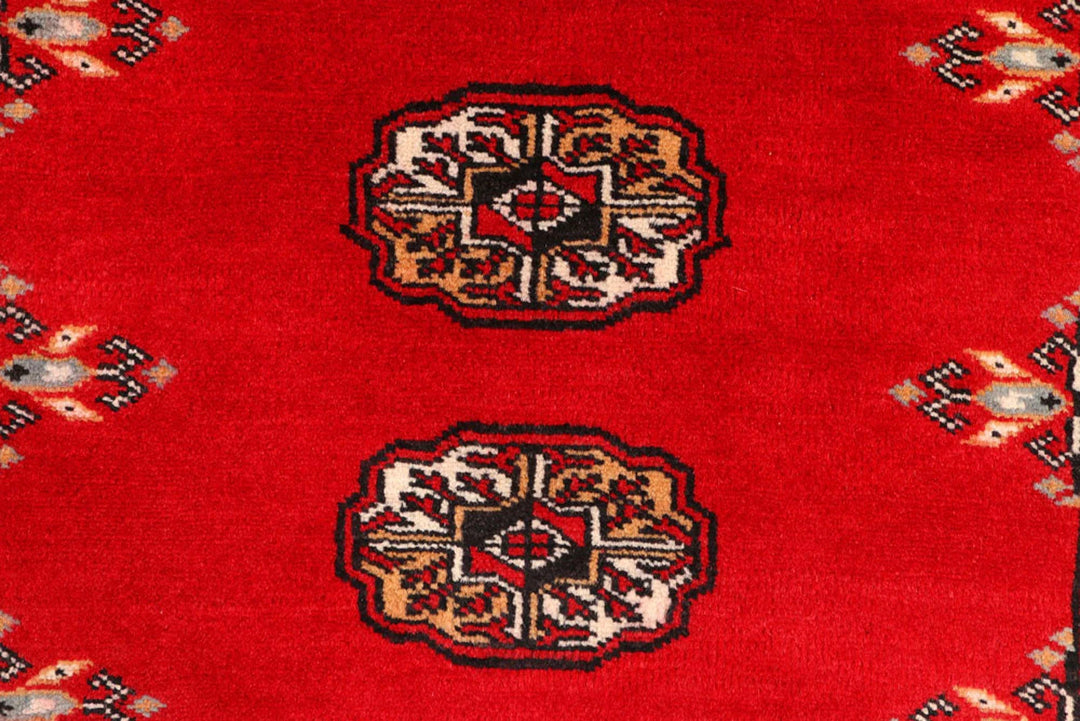 Red Pakistani Bokhara Rug 2' 7" x 9' 1" Hand-Knotted | No. QA40235