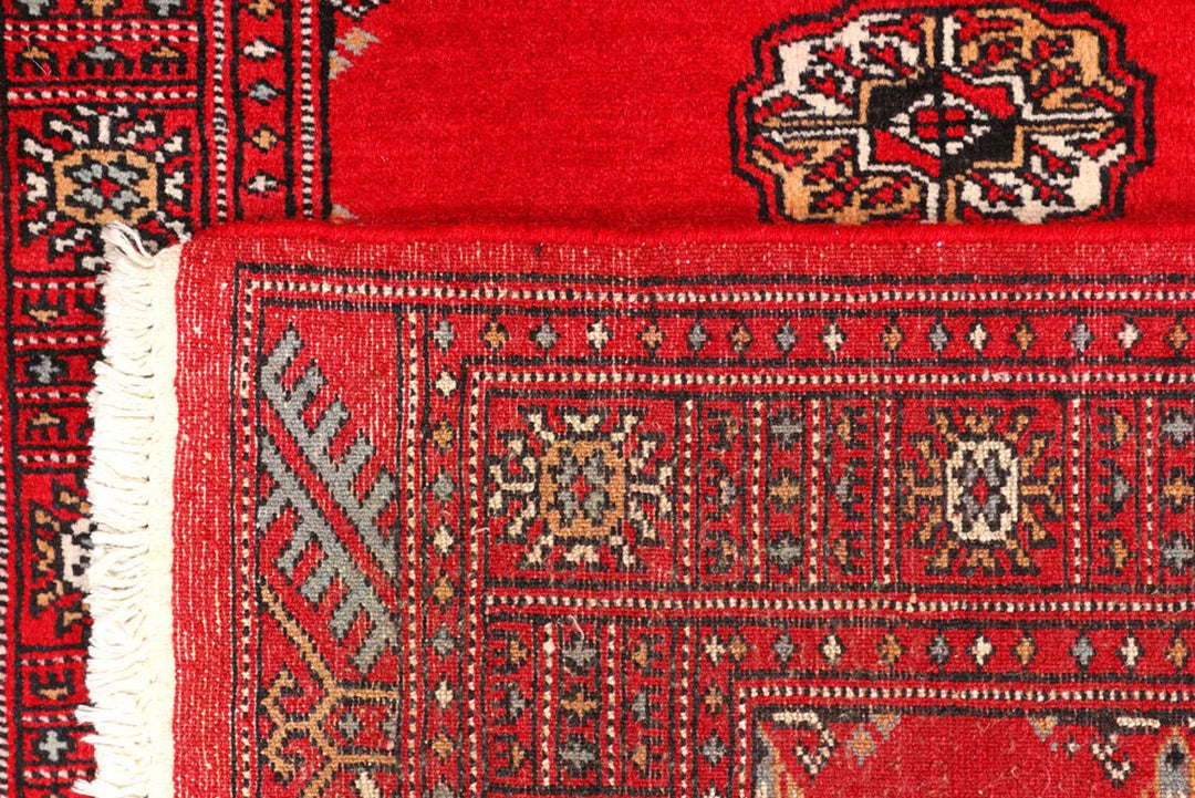 Red Pakistani Bokhara Rug 2' 7" x 9' 1" Hand-Knotted | No. QA40235