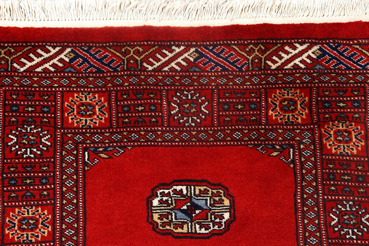 Red Pakistani Bokhara Rug 2' 7" x 10' 4" Hand-Knotted | No. QA41380