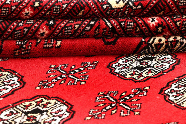 Red Pakistani Bokhara Rug 6' 3" x 9' 3" Hand-Knotted | No. QA41770