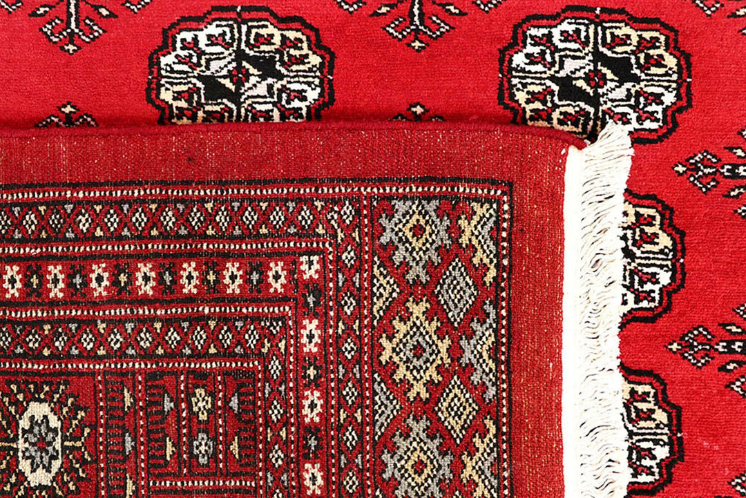 Red Pakistani Bokhara Rug 6' 3" x 9' 3" Hand-Knotted | No. QA41770
