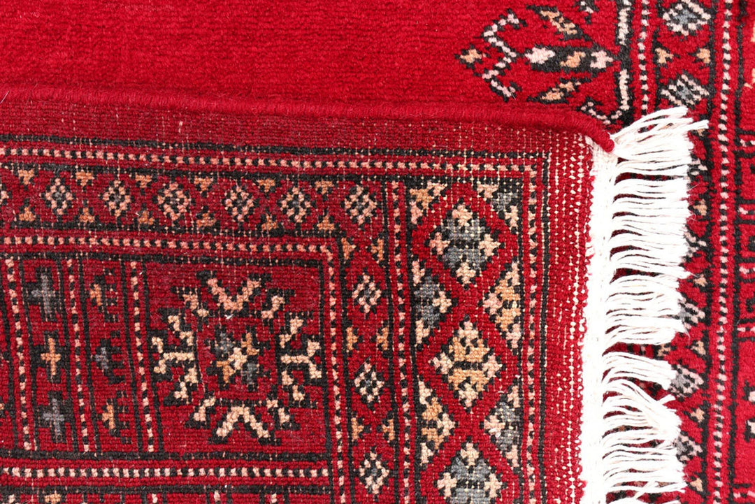 Dark Red Pakistani Bokhara Rug 2' 7" x 8' 8" Hand-Knotted | No. QA42764