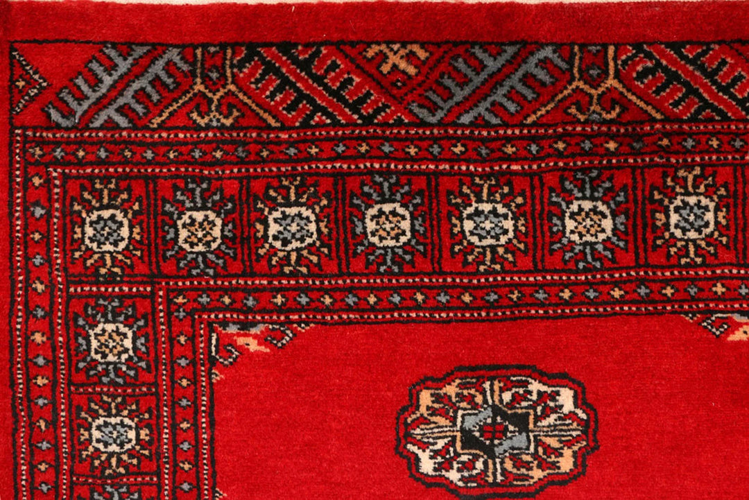 Red Pakistani Bokhara Rug 2' 7" x 9' 5" Hand-Knotted | No. QA42970