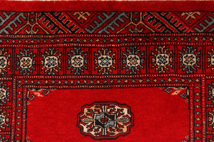 Red Pakistani Bokhara Rug 2' 7" x 9' 5" Hand-Knotted | No. QA42970