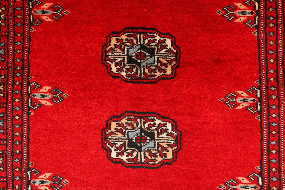 Red Pakistani Bokhara Rug 2' 7" x 9' 5" Hand-Knotted | No. QA42970