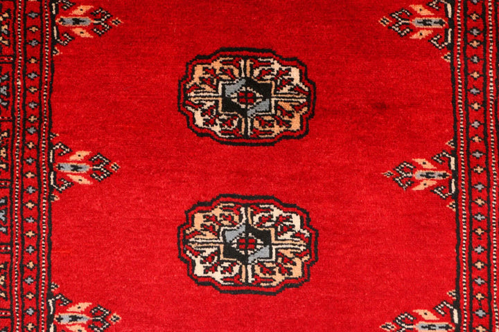 Red Pakistani Bokhara Rug 2' 7" x 9' 5" Hand-Knotted | No. QA42970
