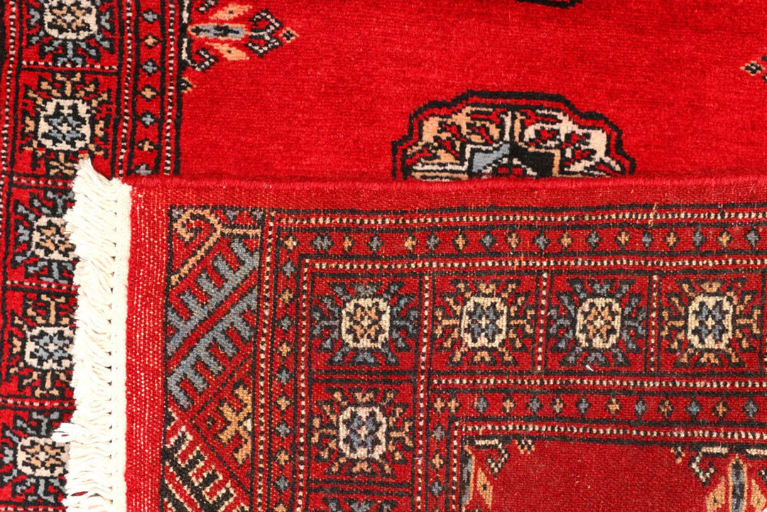 Red Pakistani Bokhara Rug 2' 7" x 9' 5" Hand-Knotted | No. QA42970