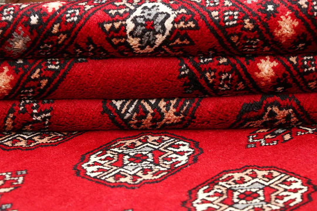 Red Pakistani Bokhara Rug 5' 8" x 8' 2" Hand-Knotted | No. QA44257