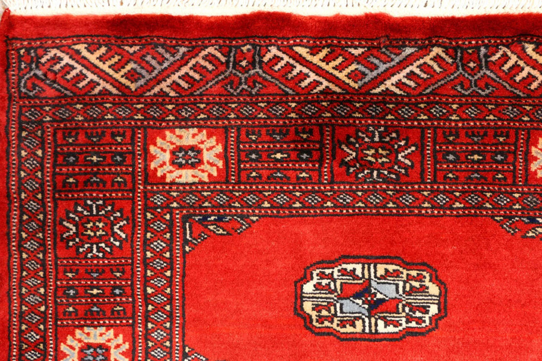 Red Pakistani Bokhara Rug 2' 7" x 9' 3" Hand-Knotted | No. QA46029