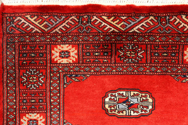 Red Pakistani Bokhara Rug 2' 7" x 9' 3" Hand-Knotted | No. QA46029