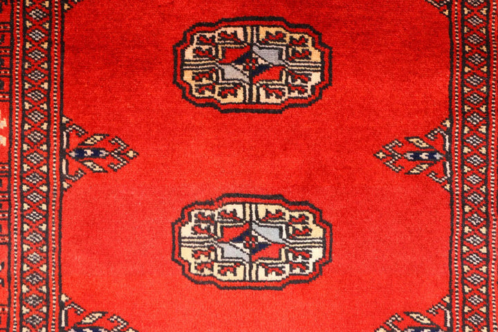 Red Pakistani Bokhara Rug 2' 7" x 9' 3" Hand-Knotted | No. QA46029