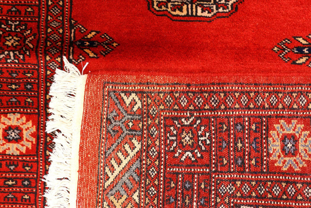 Red Pakistani Bokhara Rug 2' 7" x 9' 3" Hand-Knotted | No. QA46029