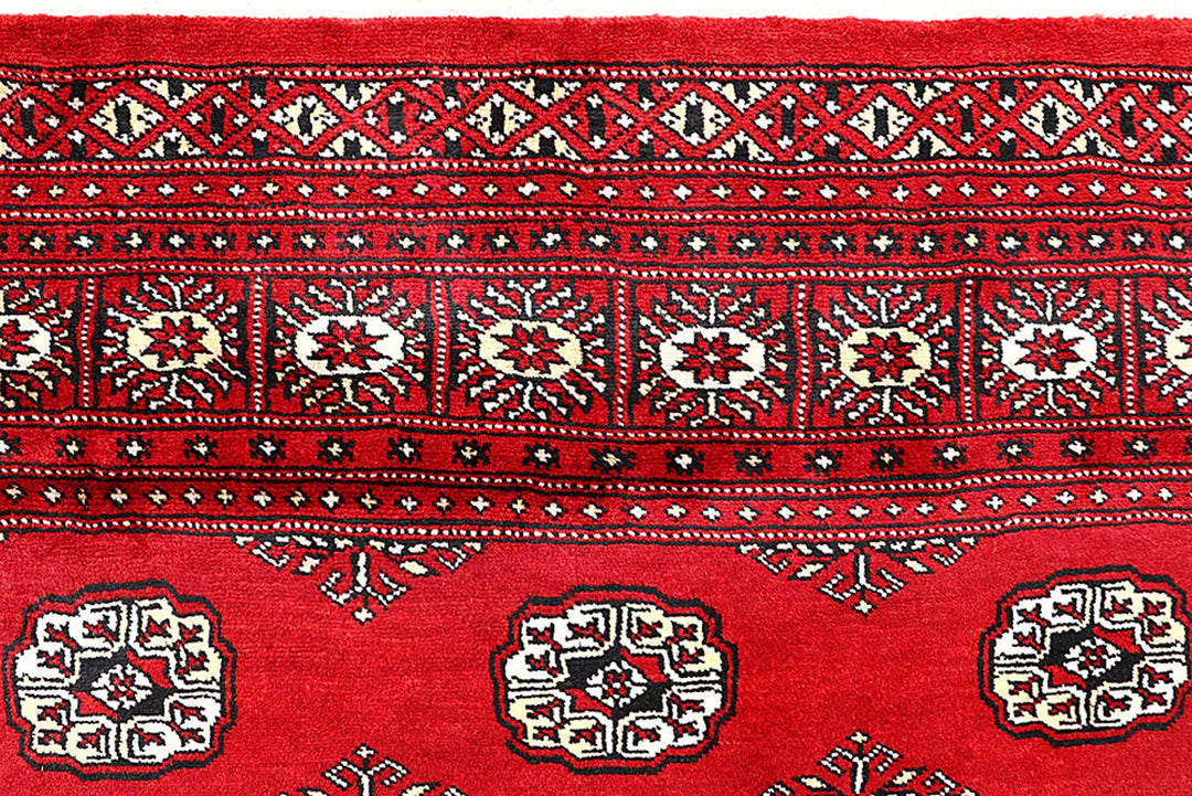 Firebrick Pakistani Bokhara Rug 5' 2" x 9' 1" Hand-Knotted | No. QA46764