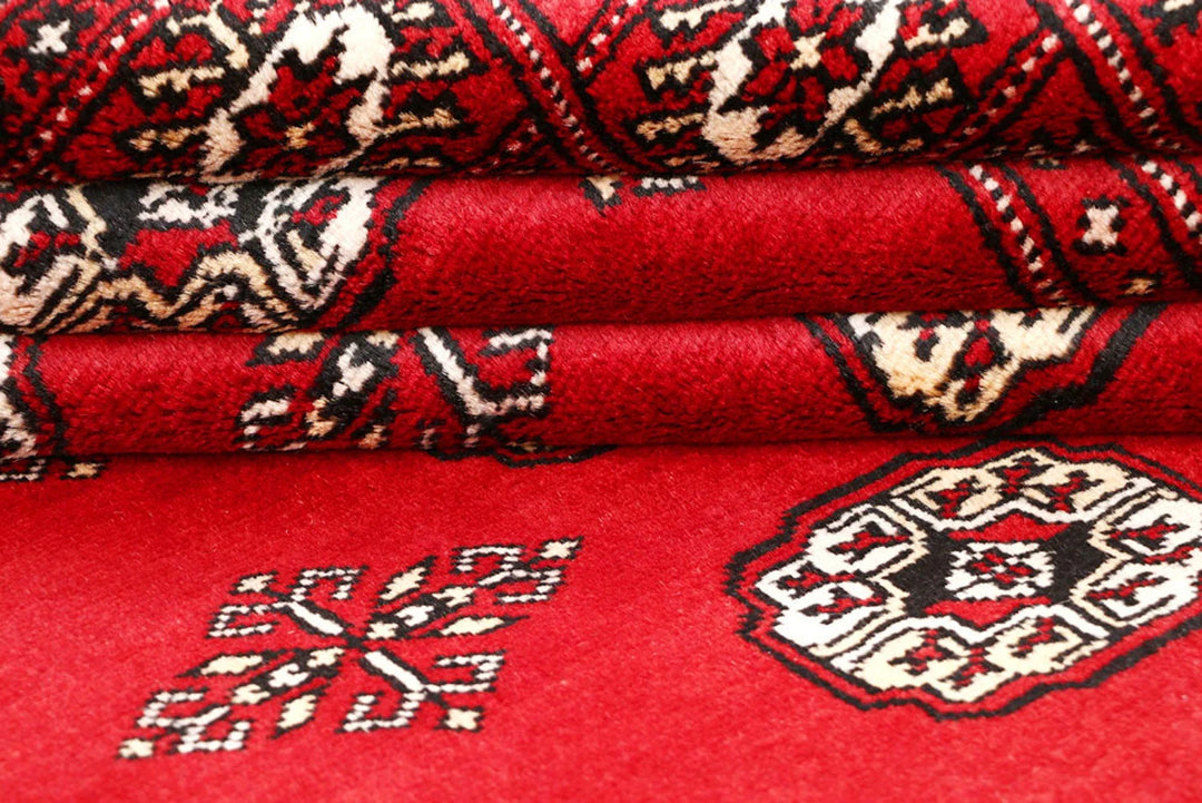 Firebrick Pakistani Bokhara Rug 5' 2" x 9' 1" Hand-Knotted | No. QA46764