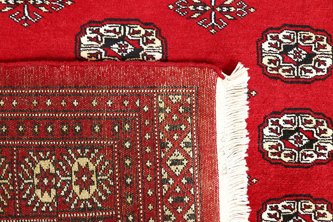 Firebrick Pakistani Bokhara Rug 5' 2" x 9' 1" Hand-Knotted | No. QA46764