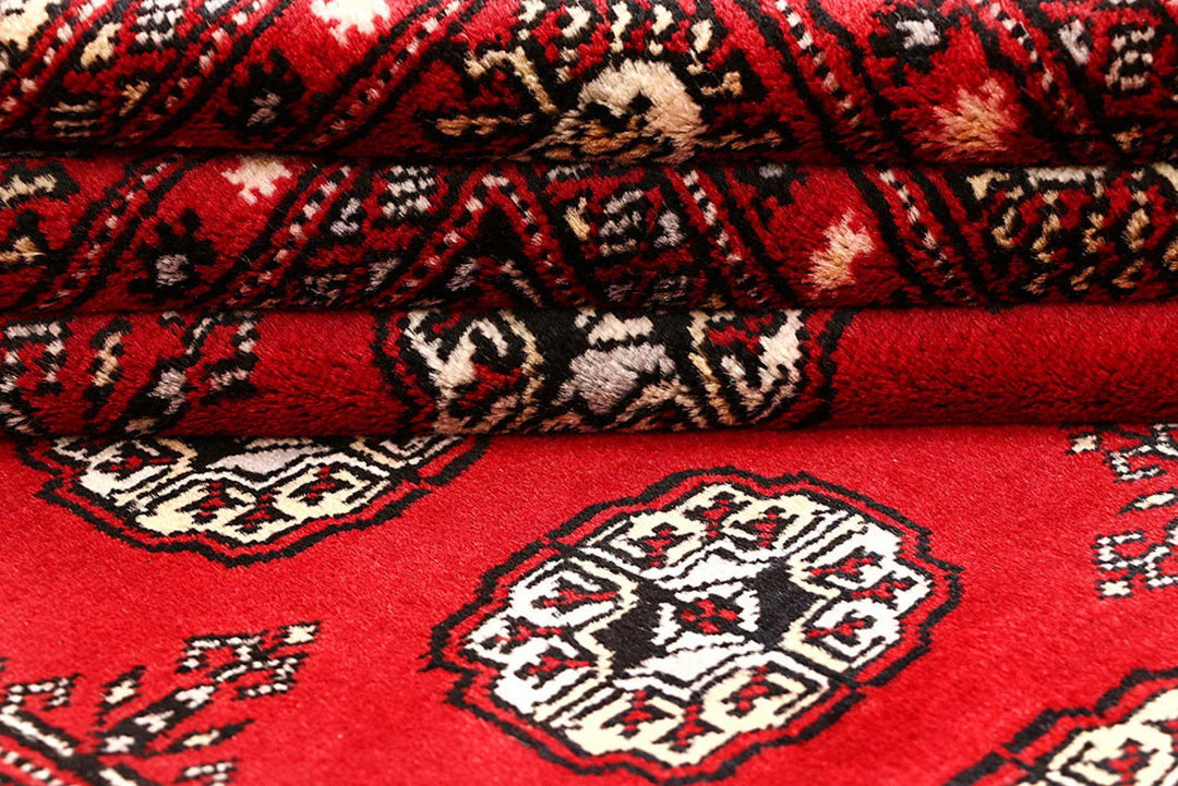 Red Pakistani Bokhara Rug 4' 2" x 6' 8" Hand-Knotted | No. QA47148
