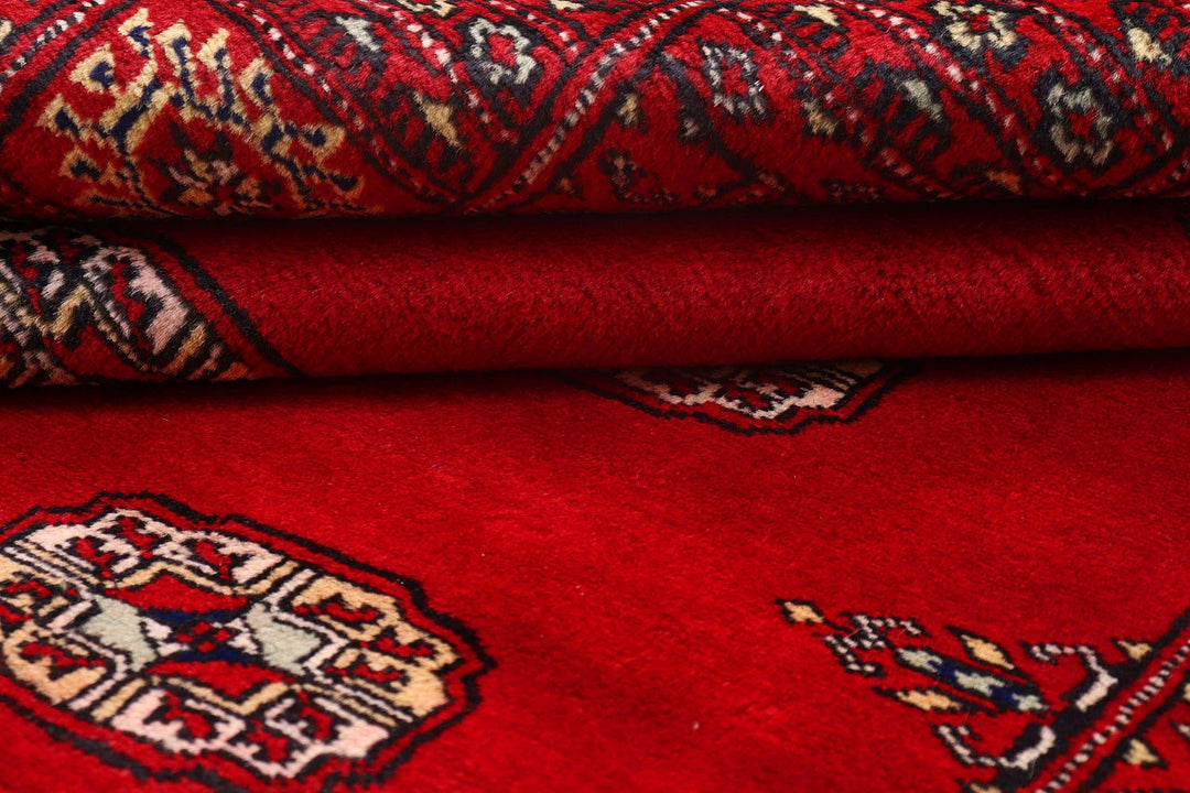 Red Pakistani Bokhara Rug 4' 1" x 6' 1" Hand-Knotted | No. QA47356