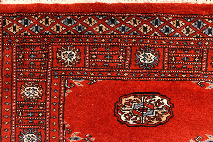 Dark Red Pakistani Bokhara Rug 2' 7" x 10' 3" Hand-Knotted | No. QA47484