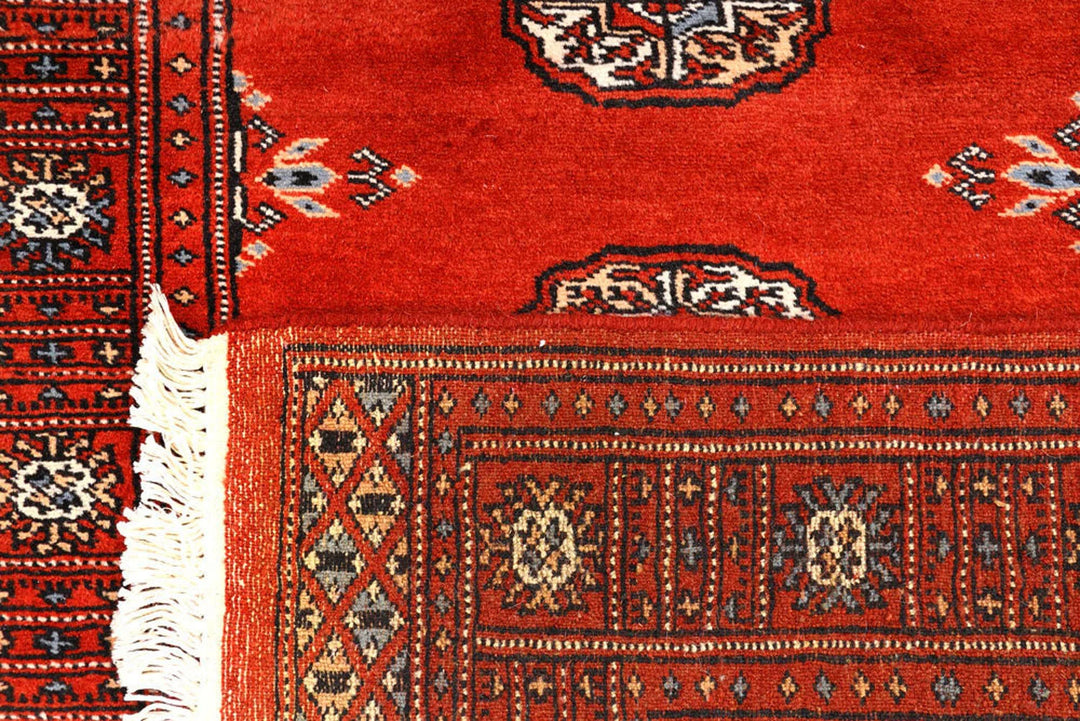 Dark Red Pakistani Bokhara Rug 2' 7" x 10' 3" Hand-Knotted | No. QA47484