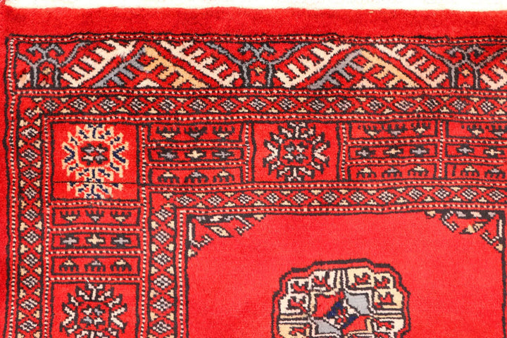 Red Pakistani Bokhara Rug 2' 6" x 10' 8" Hand-Knotted | No. QA48610