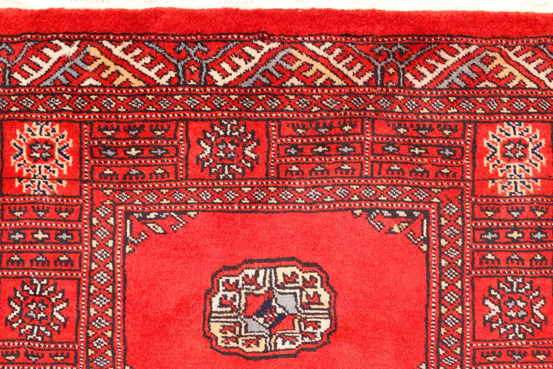 Red Pakistani Bokhara Rug 2' 6" x 10' 8" Hand-Knotted | No. QA48610