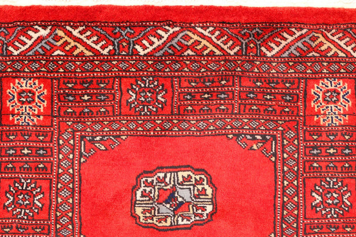 Red Pakistani Bokhara Rug 2' 6" x 10' 8" Hand-Knotted | No. QA48610