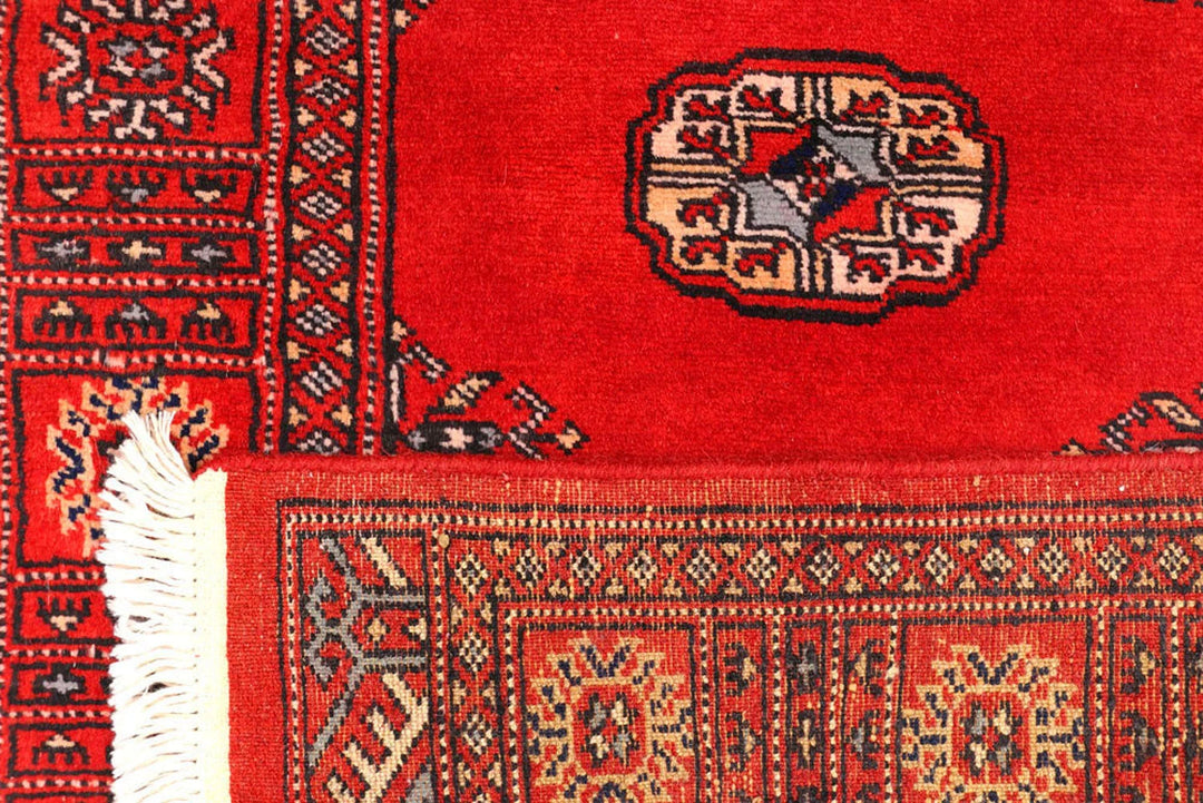 Red Pakistani Bokhara Rug 2' 6" x 10' 8" Hand-Knotted | No. QA48610