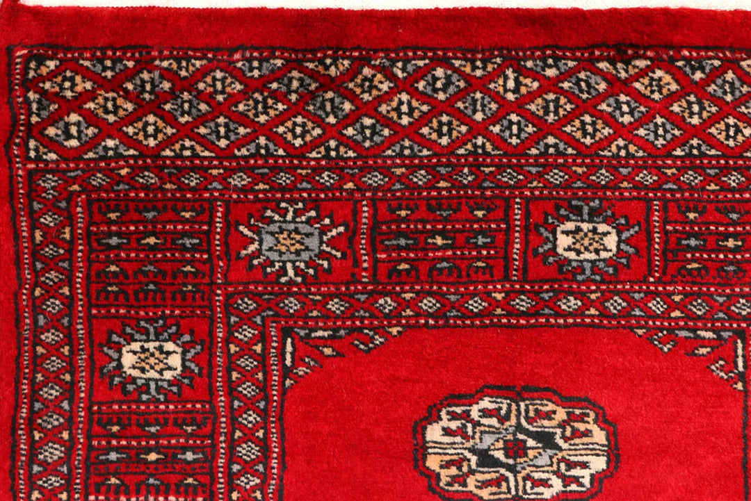 Red Pakistani Bokhara Rug 2' 5" x 8' 9" Hand-Knotted | No. QA48665