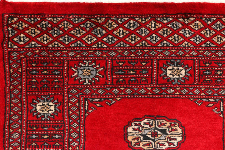 Red Pakistani Bokhara Rug 2' 5" x 8' 9" Hand-Knotted | No. QA48665