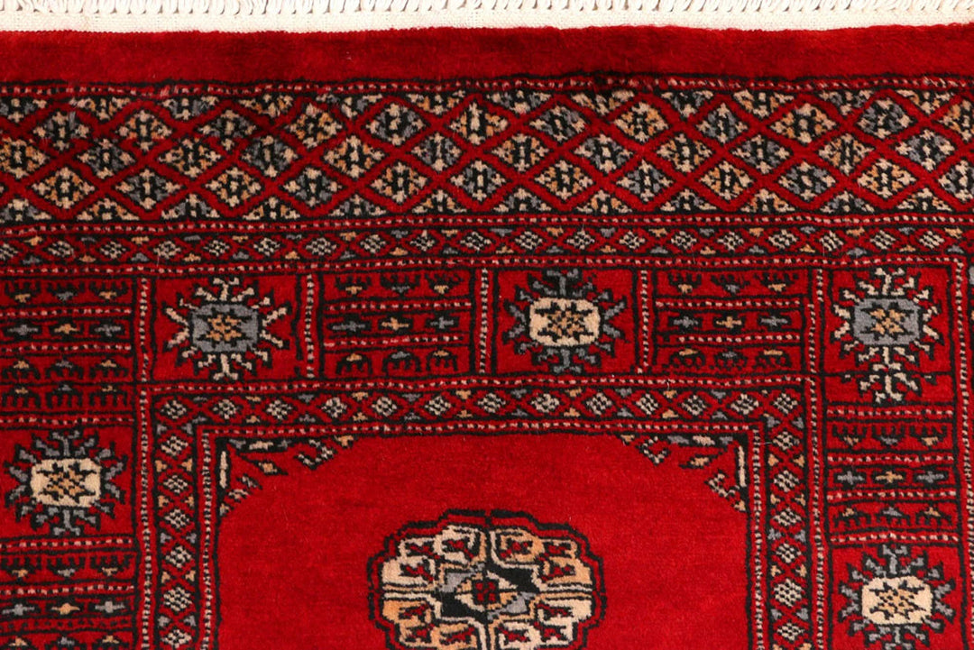 Red Pakistani Bokhara Rug 2' 5" x 8' 9" Hand-Knotted | No. QA48665