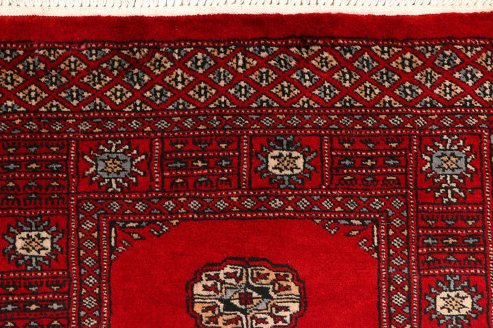 Red Pakistani Bokhara Rug 2' 5" x 8' 9" Hand-Knotted | No. QA48665