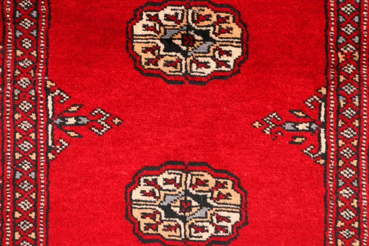 Red Pakistani Bokhara Rug 2' 5" x 8' 9" Hand-Knotted | No. QA48665