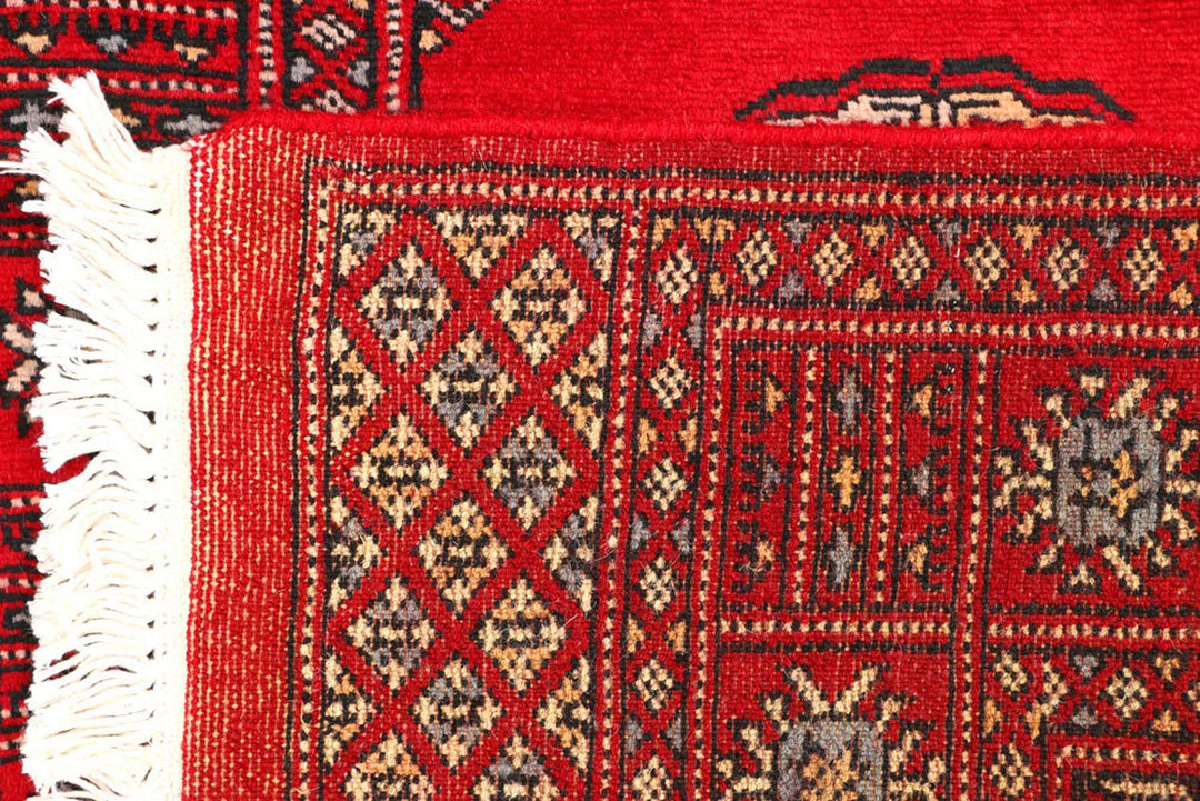 Red Pakistani Bokhara Rug 2' 5" x 8' 9" Hand-Knotted | No. QA48665