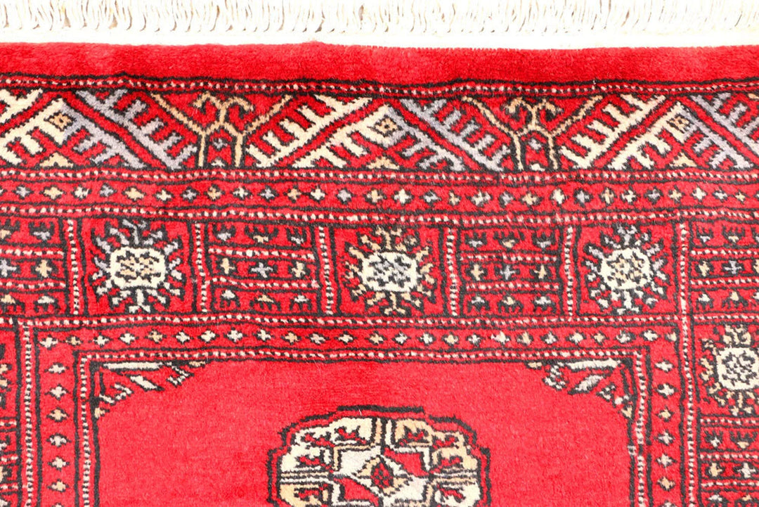 Red Pakistani Bokhara Rug 2' 6" x 6' 8" Hand-Knotted | No. QA48992