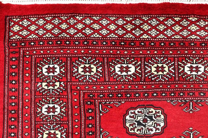 Red Pakistani Bokhara Rug 4' 1" x 6' 1" Hand-Knotted | No. QA49265