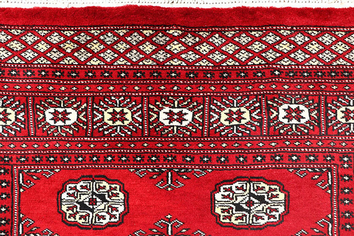 Red Pakistani Bokhara Rug 4' 1" x 6' 1" Hand-Knotted | No. QA49265